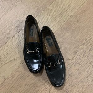 Gucci black loafers with silver buckle